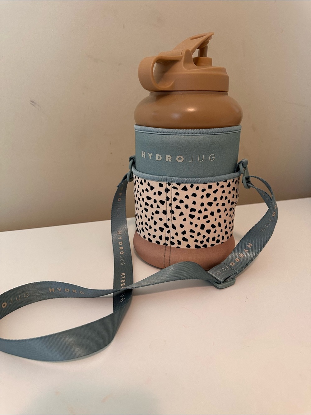 HydroJug Blue Strap with Tan Lid and Speckled Accent Crossbody Bottle